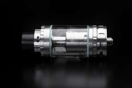 Vape. Tank from an electronic cigarette on a black background. Electronic cigaretteの写真素材