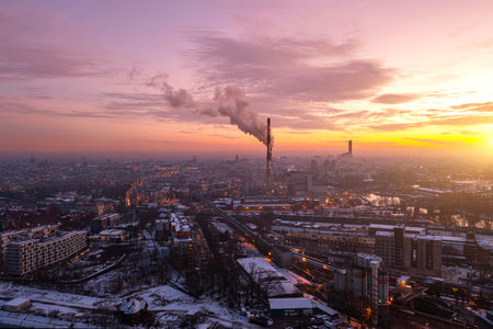 Industrial area of the city from a height, pollution of the city by the nearest factories and...