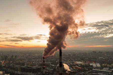 Dense smoke from a thermal power plant over residential areas of the city. drone view. Wroclaw, Polandの写真素材