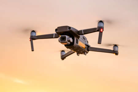 Quadcopter in flight against the sky, view from below. close-upの写真素材