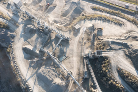 Aerial view of a gravel pit in Poland. Conveyor belts distribute the stone. Heavy industry