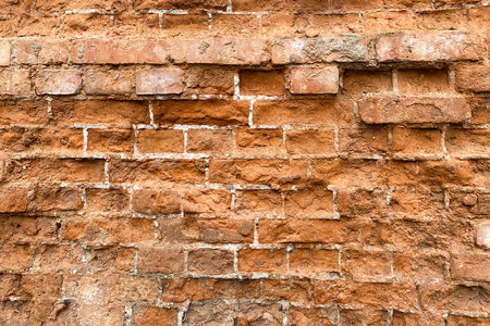 Old destroyed brick wall, ruined brick for background