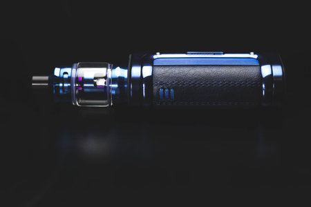 a large electronic cigarette on a black background, smoking mixtures with nicotine, an analogue of...