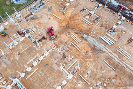 Top view of the foundation and concrete columns at the construction site, construction of industrial...