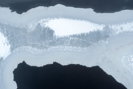 Beautiful patterns of melting ice. Ice washes the water on the lake, melts.