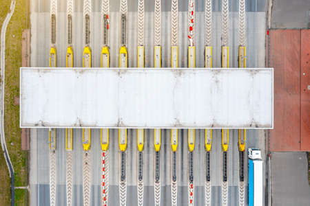 View from a height of the checkpoint. Cars pass through an automatic toll booth on a toll road in Europe. Polandの写真素材