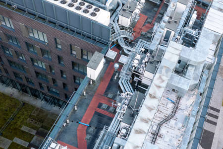 Air conditioning system on the roof of the building, advanced air conditioning and ventilation system, aerial view down the roof of the house, many different ventilation ductsの写真素材