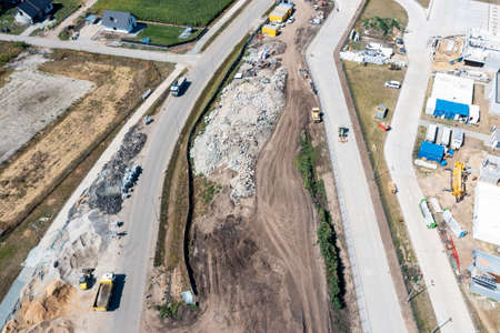 Aerial view of repair work on the road, a lot of machinery doing repair workの写真素材