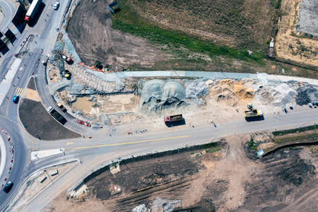 Aerial view of repair work on the road, a lot of machinery doing repair workの写真素材