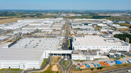 Aerial view of industrial area with many industrial buildings, consumer electronics factoryの写真素材