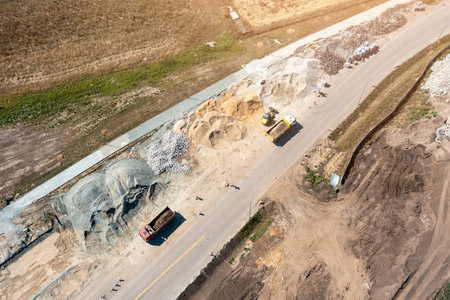 Aerial view of repair work on the road, a lot of machinery doing repair work