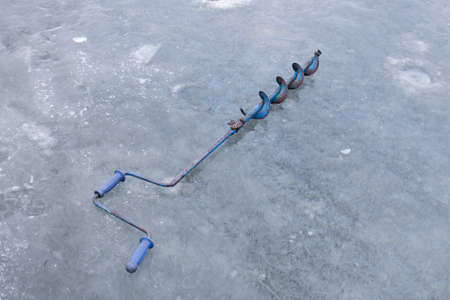 equipment for winter fishing on ice. ice drillの写真素材