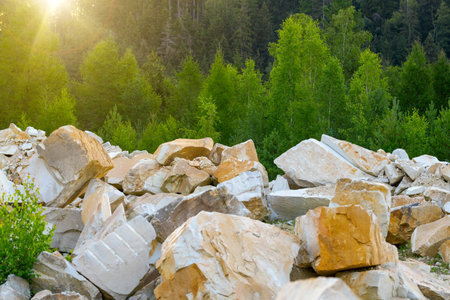 Many scattered stones at the foot of the cliffの写真素材