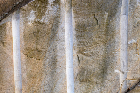 Rock with round holes for laying explosives, Setting dynamite in the rockの写真素材