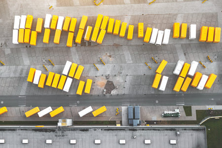 Top view of trucks with a trailer, large parking lot for trailers, transportation company