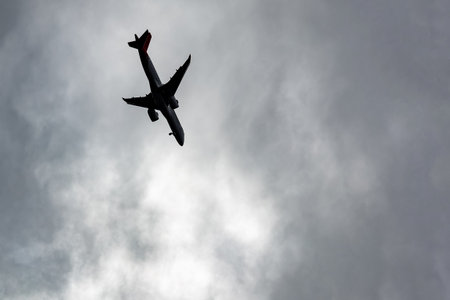 The plane is falling. Plane crash, uncontrolled aircraft in a tailspinの写真素材