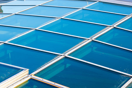 Figured glass roof, blue glass on the roof of the buildingの写真素材