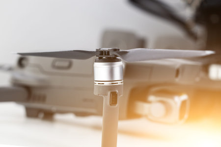 Close-up of the engine and propeller of a quadcopter, an unmanned aerial vehicle for filming