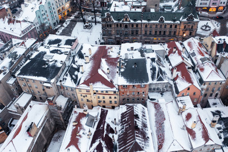 Aerial view of a snowy old German town, aerial view of the snow-covered roofs of houses, winter landscapeの写真素材