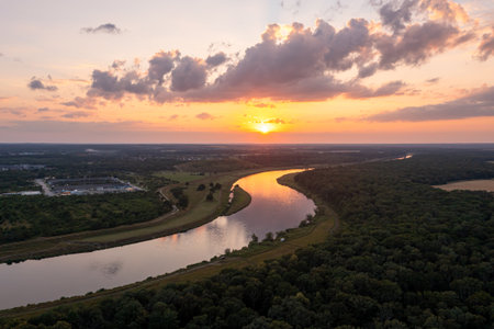 Aerial view of a winding river at sunsetの写真素材