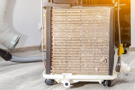 Dirty refrigerator radiator, cooler clogged with dust and dirtの写真素材