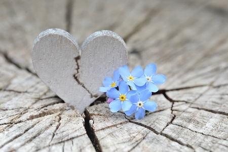 Broken Heart on wooden background.の写真素材