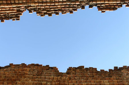 Old brick wall with blue sky.の写真素材