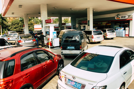A large number of cars stand in line at the gas station sinopecのeditorial素材