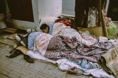 Chinese homeless people sleep on the sidewalkのeditorial素材