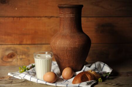 Still life with milk, bread and eggsの写真素材