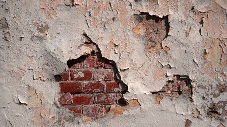 Old red brick wall background with old paintingの写真素材