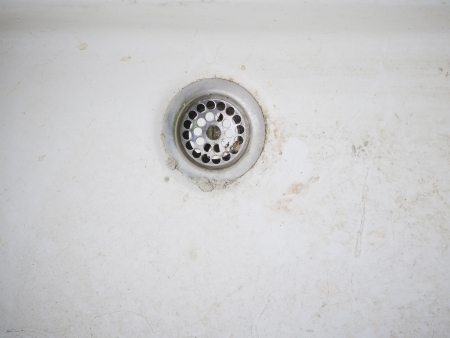 ceramic earthenware sanitary siphon dirt old white metal sieveの写真素材