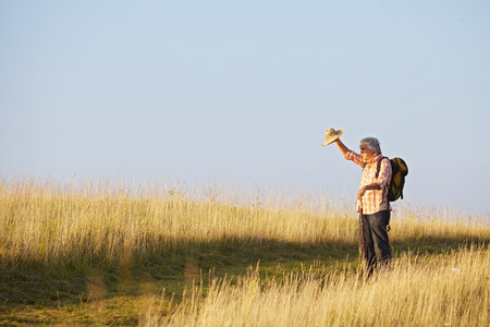Man looking into the backlight with hatの写真素材