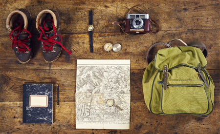 flatlay top hiking with shirt, hiking shoes and wristwatchの写真素材
