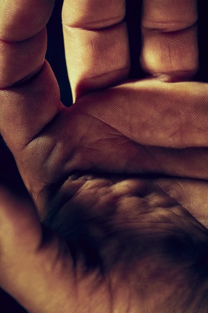 Detail of the palm in the left hand of a man. Age 50 yearsの写真素材