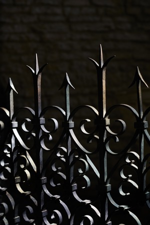 Fence bright dark wrought iron with flourishes handmadeの写真素材