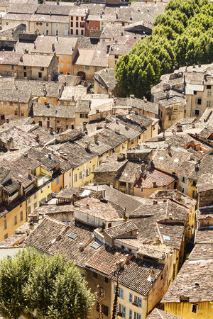 Rooftops from a bird's eye view of an old town in southern France in summerの写真素材