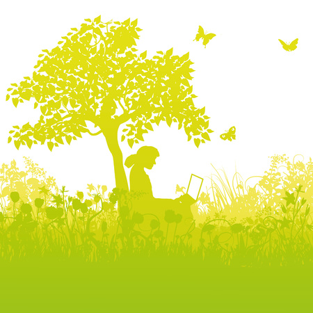 With a laptop in the grass under a tree in the gardenのイラスト素材
