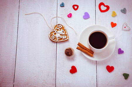 Cup of coffee with heart and candy aroundの写真素材