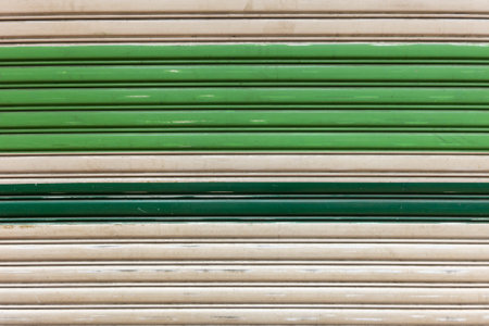 Background of old painted corrugated metal door