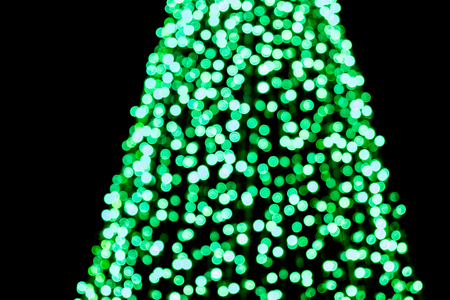 Defocused - Abstract circular green bokeh part of Christmas treeの写真素材