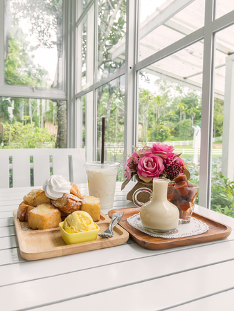 Sweet on table setting by the windowの写真素材
