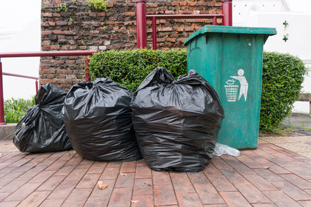Garbage bags and recycle green binの写真素材