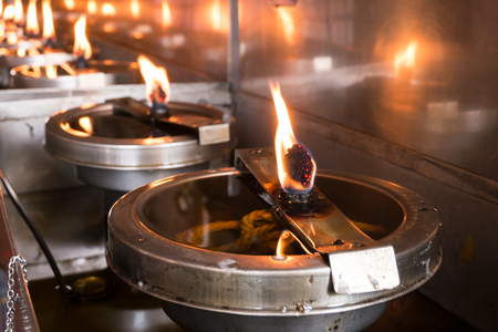 Close up candle oil light in Temple, Thailandの写真素材