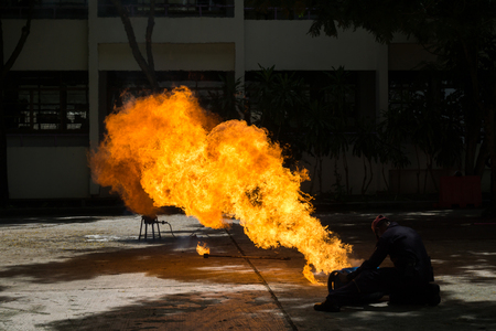 The fireman demonstrates how to suppress fire from gas tanksの写真素材