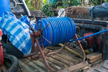 Nozzle of garden water hose on Thai truckの写真素材