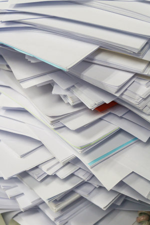 Busy, messy and cluttered workplace, full of documents