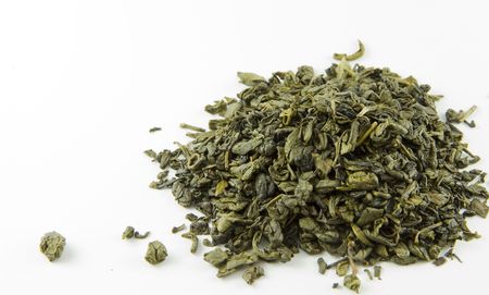  	Green tea leaves isolated on white backgroundの写真素材