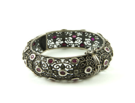  	Silver bracelet isolated on a white background