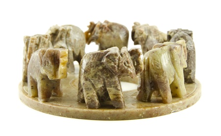  	Seven carved elephants isolated on a white backgroundの写真素材